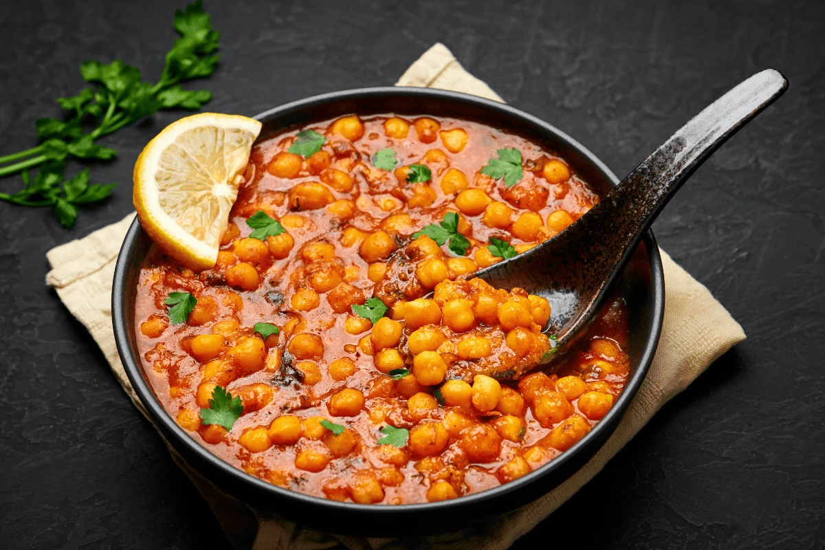 A delicious bowl of homemade Perfect Chickpea Curry served with basmati rice and naan bread.